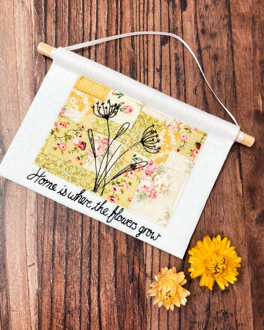 Home is where the flowers grow yellow wall hanging