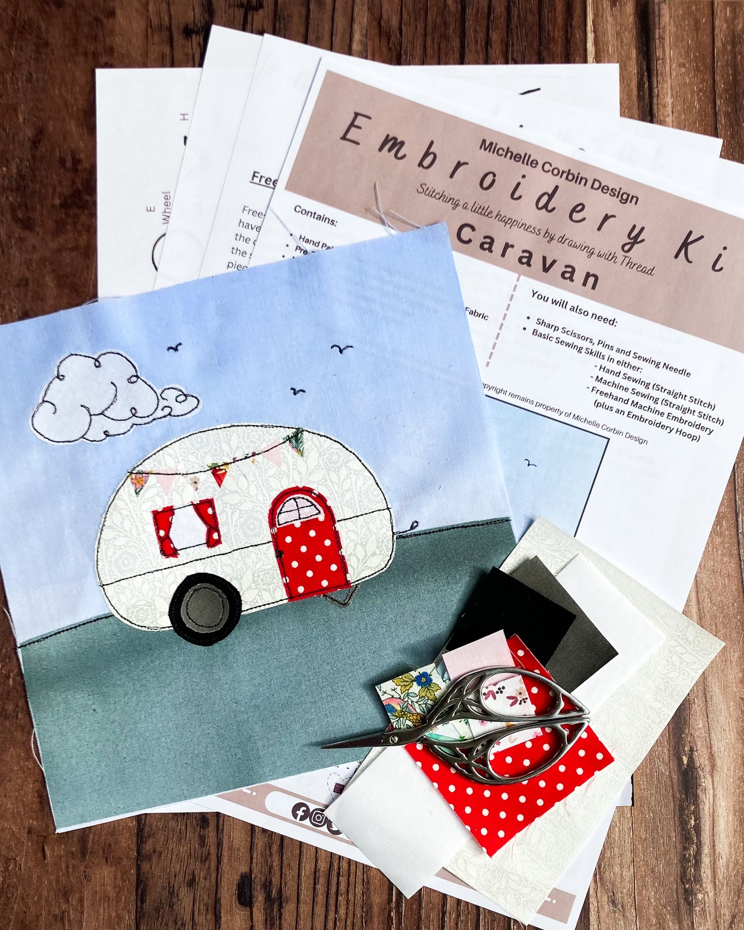 Everything that is included in the Caravan Embroidery Kit plus a finished piece as an example