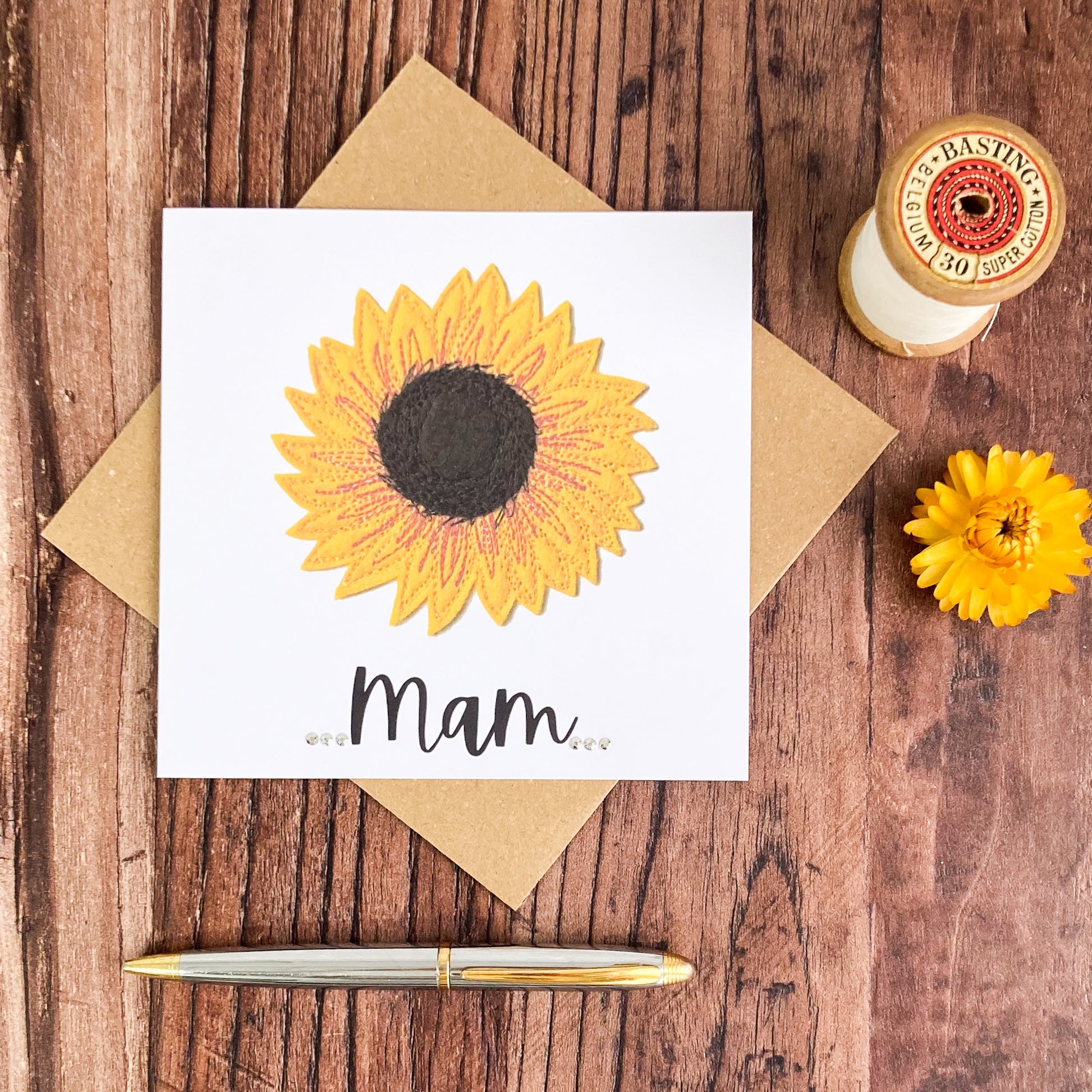 Sunflower Printed Greetings Card with the word Mam and 6 diamante, plus one brown envelope, a pen, dried flower and basting thread