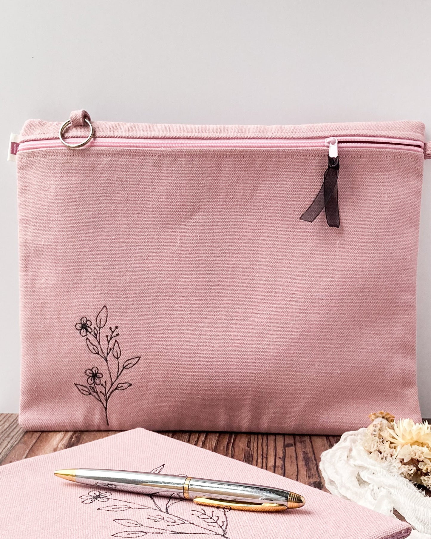 Pink Wild Flower Craft Pouch with black ribbon in zip and a key ring, plus a matching notebook and pen, with floral decor