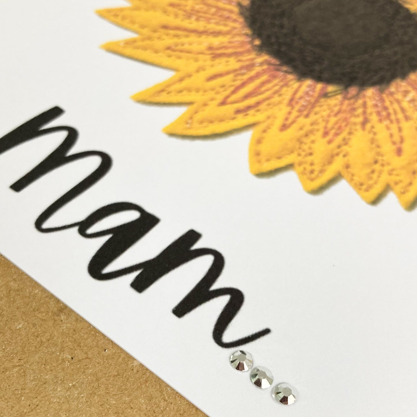 Close up of Embroidered Sunflower, with the word Mam, plus 3 diamantes